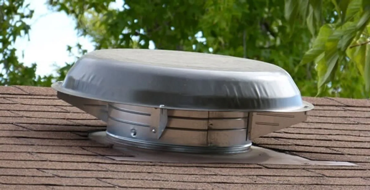 attic fan installation services with low-profile roof ventilation unit in Columbia, MO