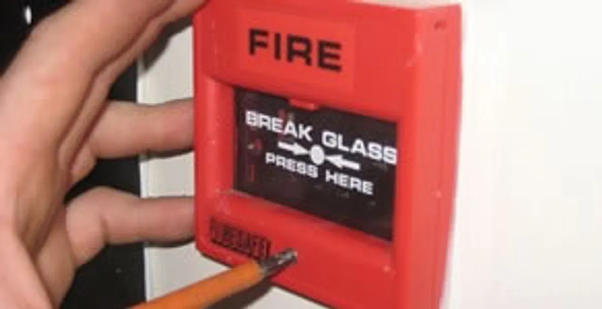 fire alarm installation service showing manual fire alarm pull station installed by licensed electricians in Columbia, MO