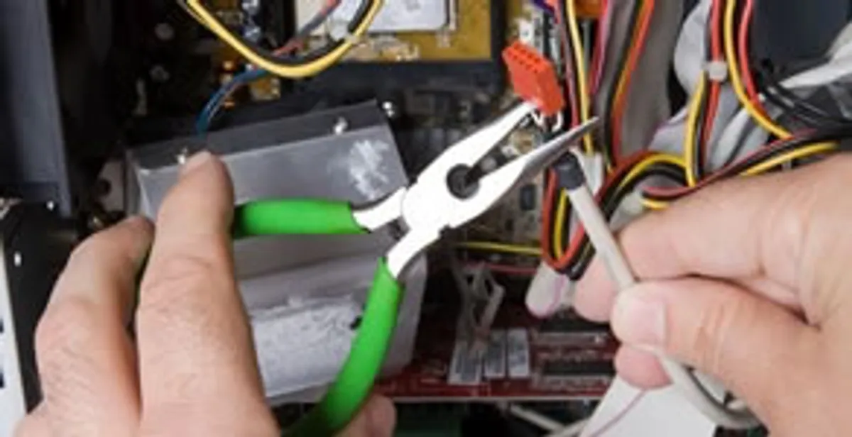Licensed electrical contractor performing electrical repair with tools in Wooldridge, MO