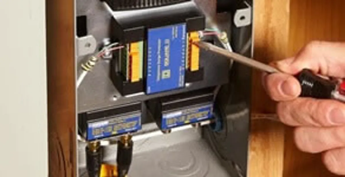 Whole home surge protection device being installed by a licensed electrician to protect electrical systems in Columbia, MO